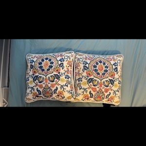 Two throw pillows. Beautiful details